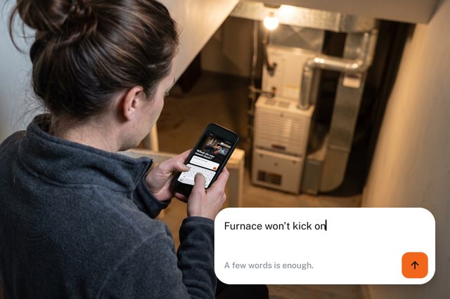 On her basement stairs, typing into CNY Pros: “Furnace won’t kick on”